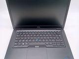 a laptop computer with a keyboard on a white surface