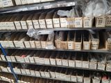many boxes on the shelves of a store that are full of items