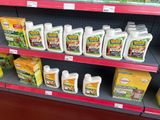 many bottles of liquid on the shelves in the store