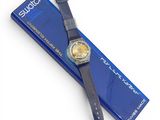 a close up of a watch on a blue box with a white background