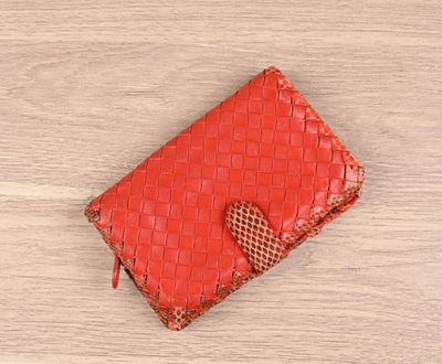 red woven leather wallet with a heart on the front