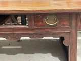 a wooden table with a drawer on top of it