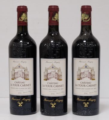 three bottles of wine sitting on top of a white table