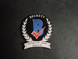 a close up of a badge on the back of a laptop computer