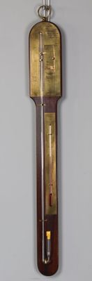 Baromètre - thermomètre sur fond plaqué d'acajou, ornementat…