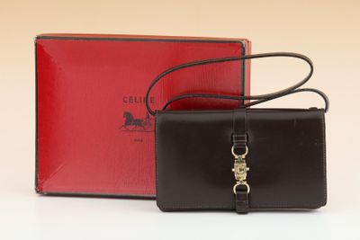 an image of a black and red purse and a red box