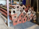 a pile of old metal pipes and pipes in a garage