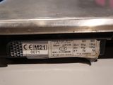 a close up of a metal plate with a price label on it