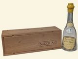 an image of a bottle of liquor next to a wooden box