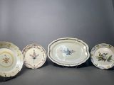 several plates are lined up in a row on a gray surface