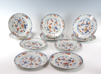 several plates and bowls are arranged on a white surface