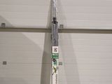 a pair of skis leaning up against a garage door