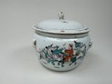 a white and blue pot with a lid on a table