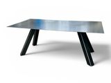 a close up of a table with a metal top on a white background