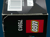 a box of legos sitting on a blue surface