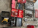 a lot of tools that are laying out on the floor