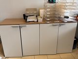 a picture of a kitchen with a lot of clutter on the counter