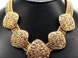 a close up of a necklace on a mannequin mannequin