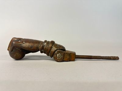 an old wooden baseball bat with a wooden handle on a white surface