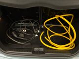 a trunk of a car with a bunch of wires in it