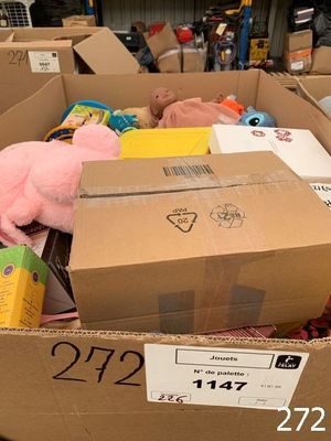a cardboard box full of stuffed animals in a store