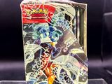 a box of pokemon trading cards on display on a table