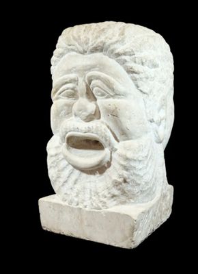 a statue of a man with a beard on a black background