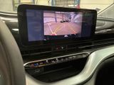 a picture of a car dashboard with a monitor on it