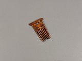 a small wooden comb on a table with a white background