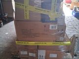 boxes stacked on top of each other on a pallet in a warehouse