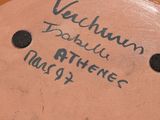 a close up of a plate with writing on it
