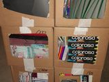 cardboard boxes are stacked on top of each other in a room