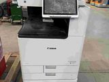 a printer that is sitting on a pallet in a warehouse
