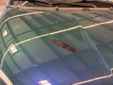 an image of a car that is parked in a garage