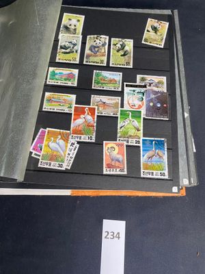 a lot of stamps that are on the table
