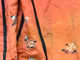 an image of a close up of a jacket with flowers on it