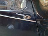 a close up of a car door handle on the side of the car