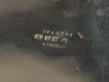 a close up of a silver plate with numbers on it