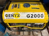a yellow generator that is sitting on the ground