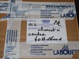 a cardboard box that has a lot of labels on it