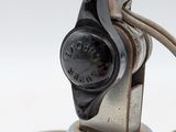 a close up of a lamp that has a cord attached to it