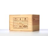 wooden box with a label on it sitting on top of a table
