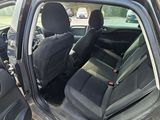 a black car with two black seats in the back of it