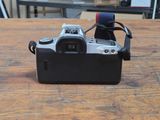 a camera that is sitting on a wooden table