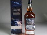 the bottle of talsker dark storm is next to the box