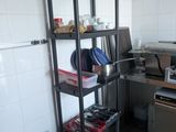 a kitchen with a stove, sink, dishwasher, and a microwave