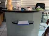 a little girl that is standing in front of a counter