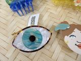 a picture of a purse with a picture of an eye on it