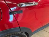 a close up of a car door handle with a sticker on it