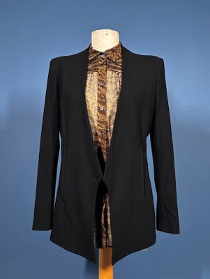 a black blazer with a leopard print shirt on a mannequin mannequin mannequin mannequin mannequin mannequin mannequin